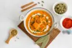 Restaurant-style Paneer Butter Masala served in a bowl with cream and coriander garnish